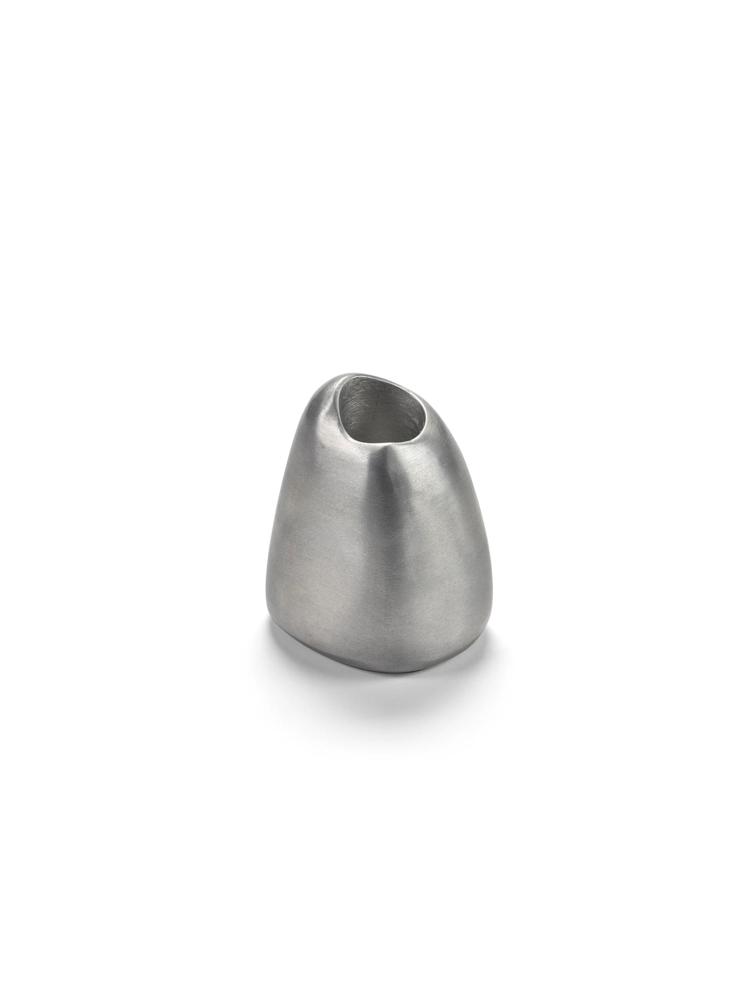 A studio shot of a single Out of Lines Candle Holder made of brushed silver or pewter metal. The holder has a smooth, organically rounded, pebble-like shape with a small, circular opening at the top for a candle. It is photographed on a white background with a soft shadow beneath it.