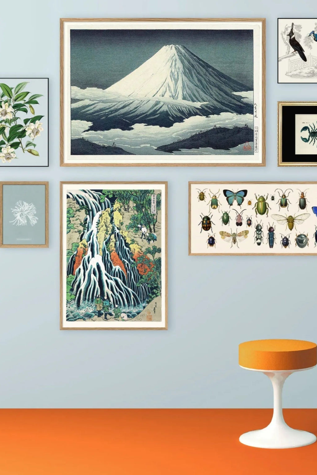 Stunning panoramic view of Mount Fuji, the highest peak in Japan, surrounded by cherry blossoms and a tranquil lake on a clear sunny day