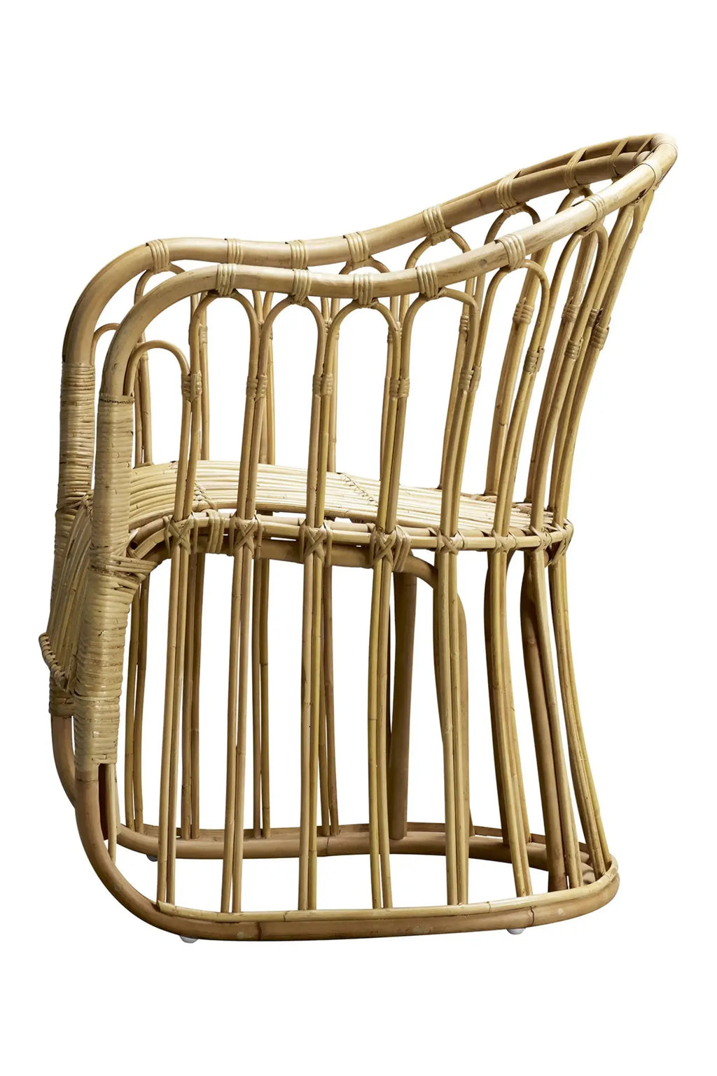 Tine K Rattan Dining Chair - Set of 2, a natural light brown rattan chair featuring a beautifully curved backrest and integrated armrests, crafted from bent rattan poles with vertical slats forming the seat and back. This sculptural and organic modern dining chair is ideal for creating a relaxed boho aesthetic in coastal dining rooms, kitchens, or as a stylish accent chair in Scandinavian-inspired living spaces.