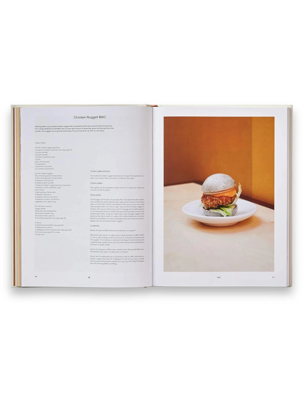 Book Bao, a beautifully designed cookbook showcasing a "Chicken Nugget BAO" recipe with a vibrant full-page photograph of a black bao bun on a white plate. This inspiring culinary book is ideal for home cooks and food enthusiasts exploring innovative recipe ideas.