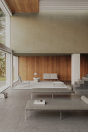 Modern indoor living space with neutral tones and minimal furniture.