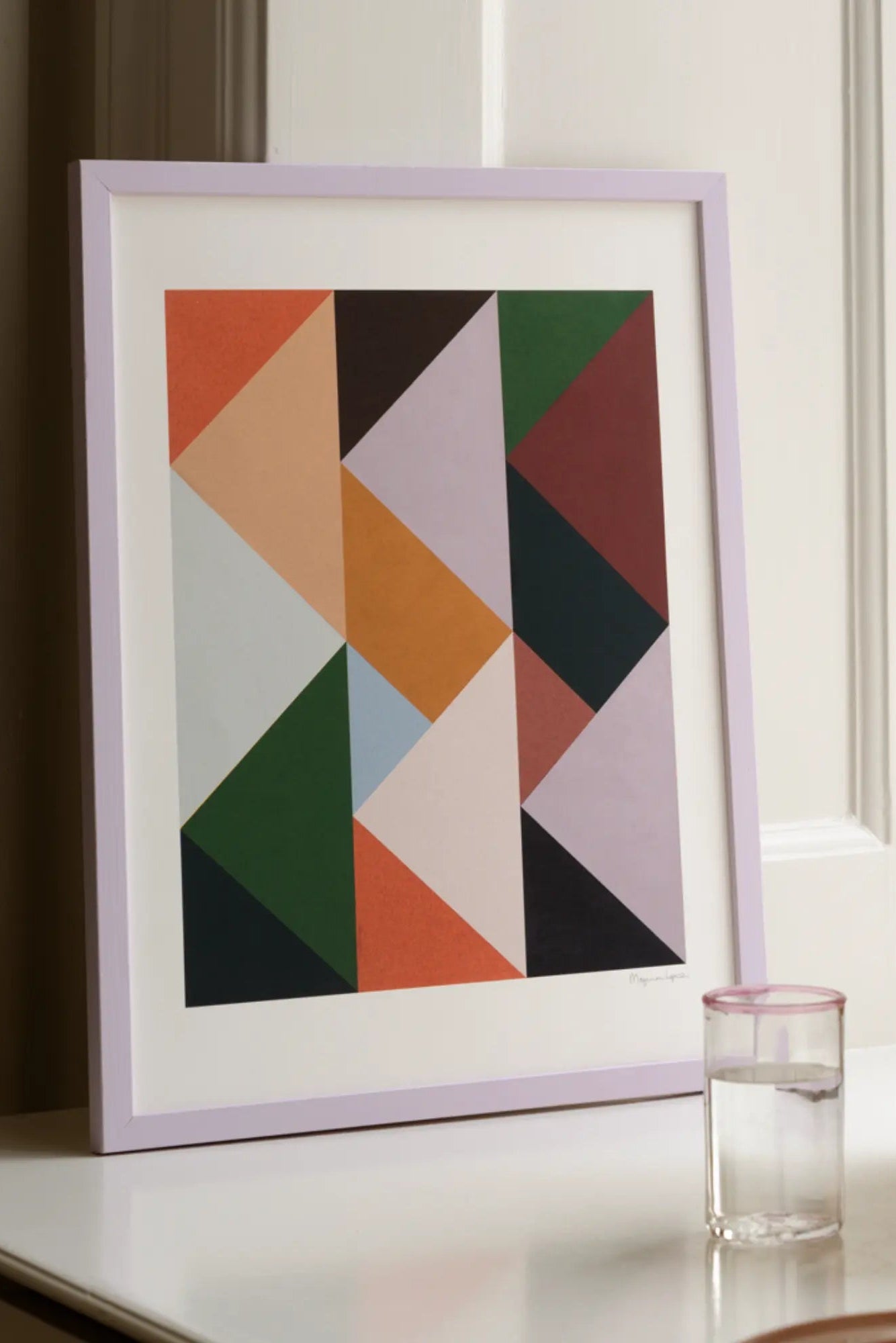 Abstract geometric design featuring triangles in various sizes and vibrant colors