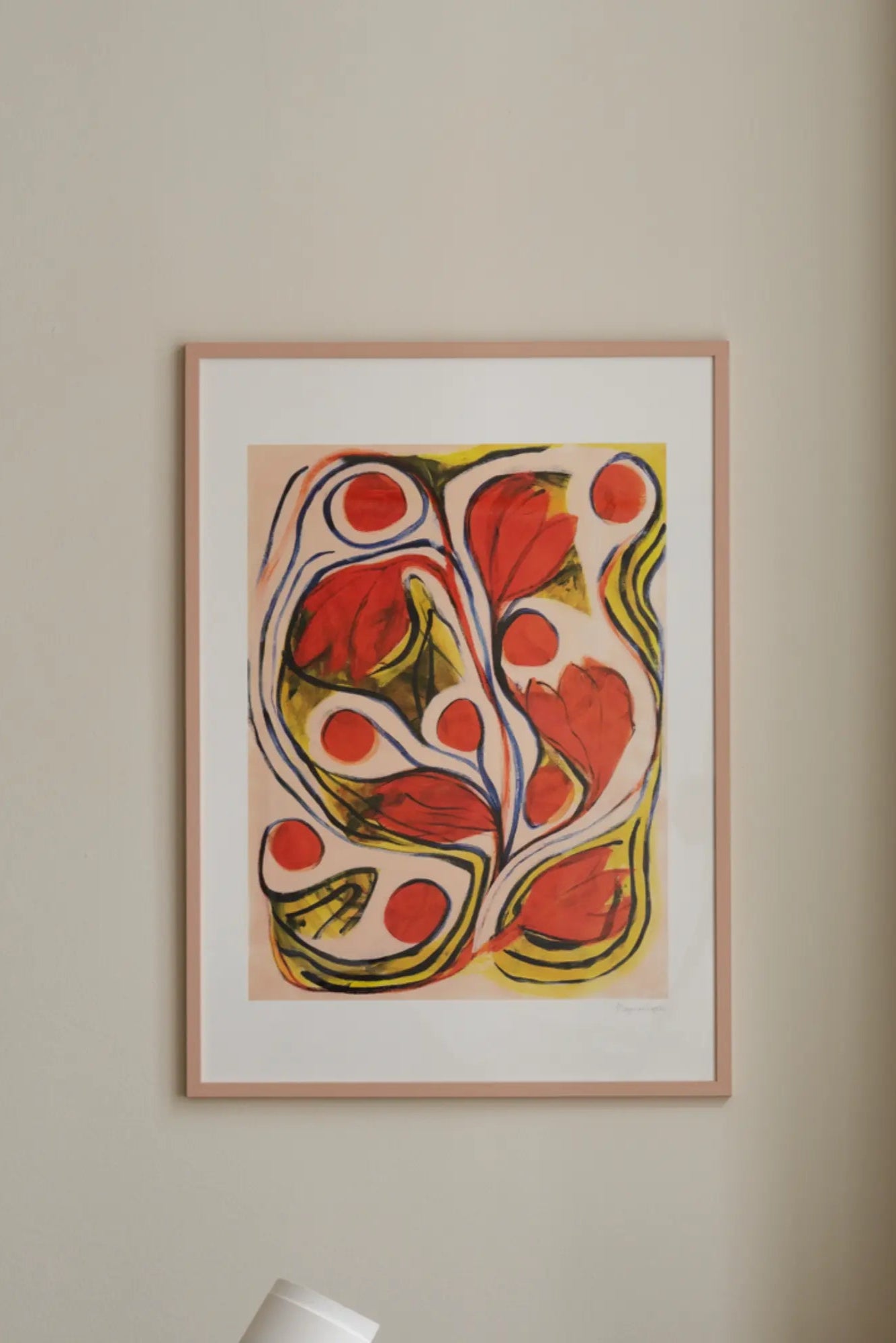 Summertime: a colorful beach umbrella casting shade on a sandy shore with seashells