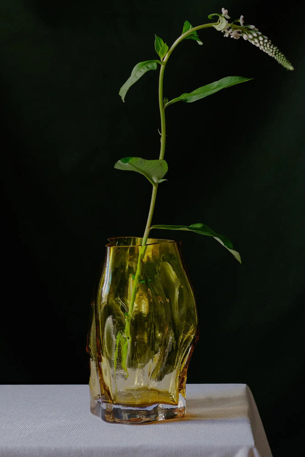 A close-up image of the small Blæhr vase from the STUDY 001 collection, showcasing its unique textured design and subtle blue hue