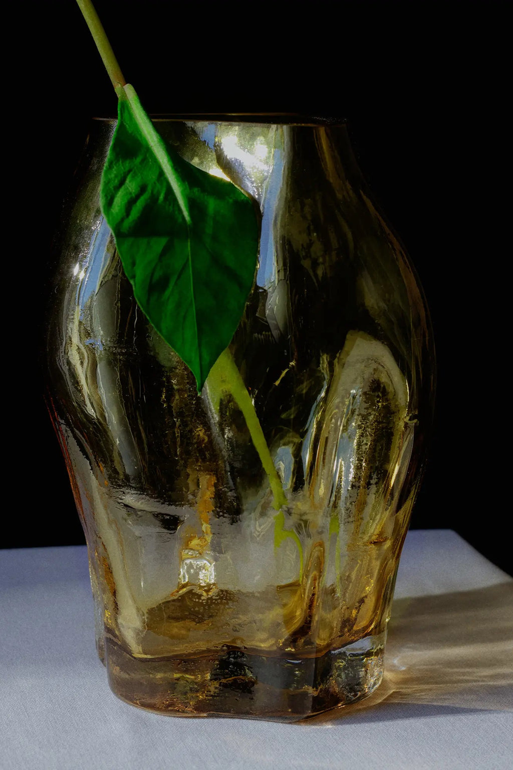 A close-up of the small Blæhr Vase from the A STUDY 001 collection, showcasing its unique handcrafted design and beautiful blue hue