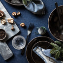 Stacked Nordic Coal Dinner Set for 4 with matching mugs, bowls, and side plates