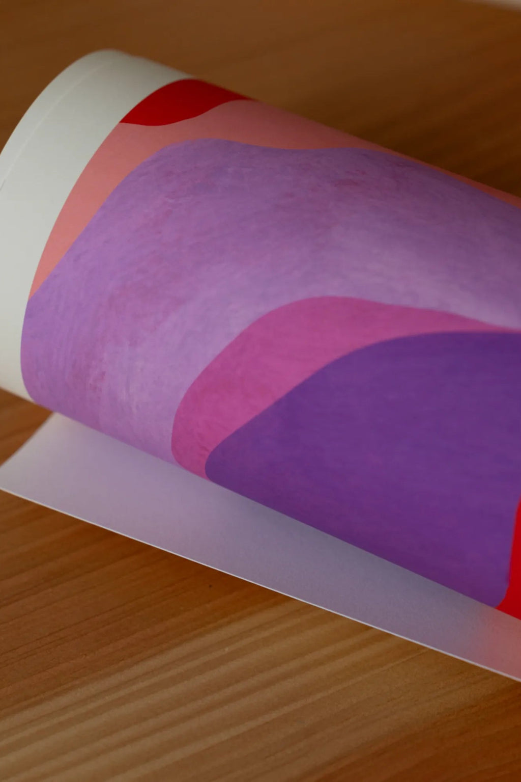 The Poster Club Aurora, a vibrant abstract art print featuring organic, wavy bands of color in shades of red, pink, and purple with a subtle painterly texture, printed on premium matte poster paper. Ideal as modern wall art for contemporary living rooms, bedrooms, or a colorful gallery wall.