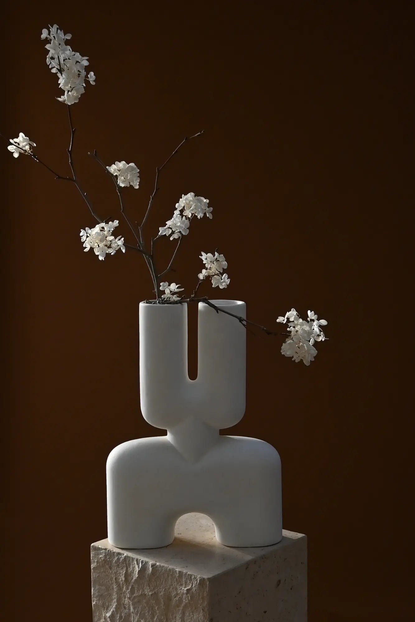 Artistic vase featuring two cobra figures entwined around the body