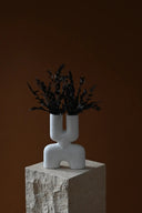 Handcrafted ceramic mini double cobra vase with intricate detailing and glossy finish
