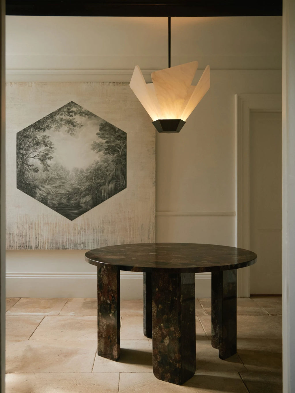 CTO Lighting Shard Pendant Light, a luxury contemporary ceiling light featuring an inverted faceted shade crafted from luminous natural alabaster 'petals' and a dark bronze finish metal base. This sculptural pendant light emits a warm, diffused glow, creating a striking focal point with its geometric design. Ideal as a modern dining room chandelier, entryway lighting, or for adding sophisticated ambiance to high-ceiling living rooms.