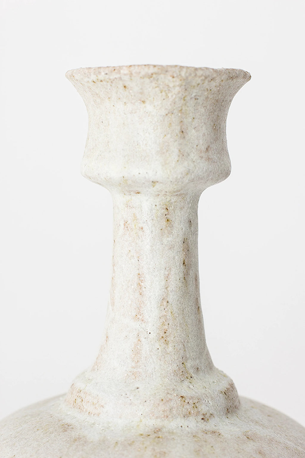 Canoa Lab Arq 005 Vase, a close-up of the upper portion, highlighting the slender neck and flared opening with a textured, matte off-white ceramic finish and natural imperfections, on a white background.