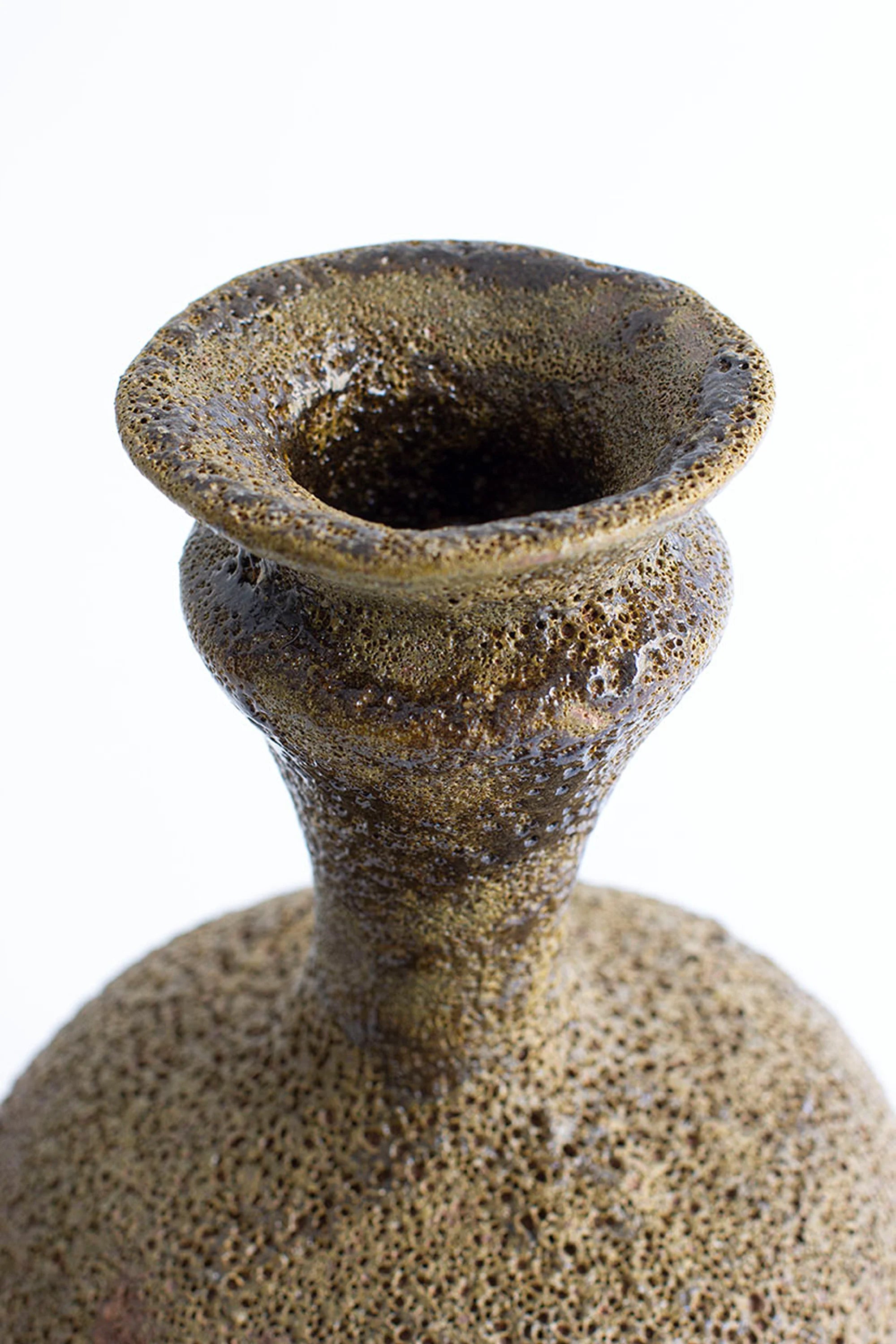 Textured ceramic vase on a white background