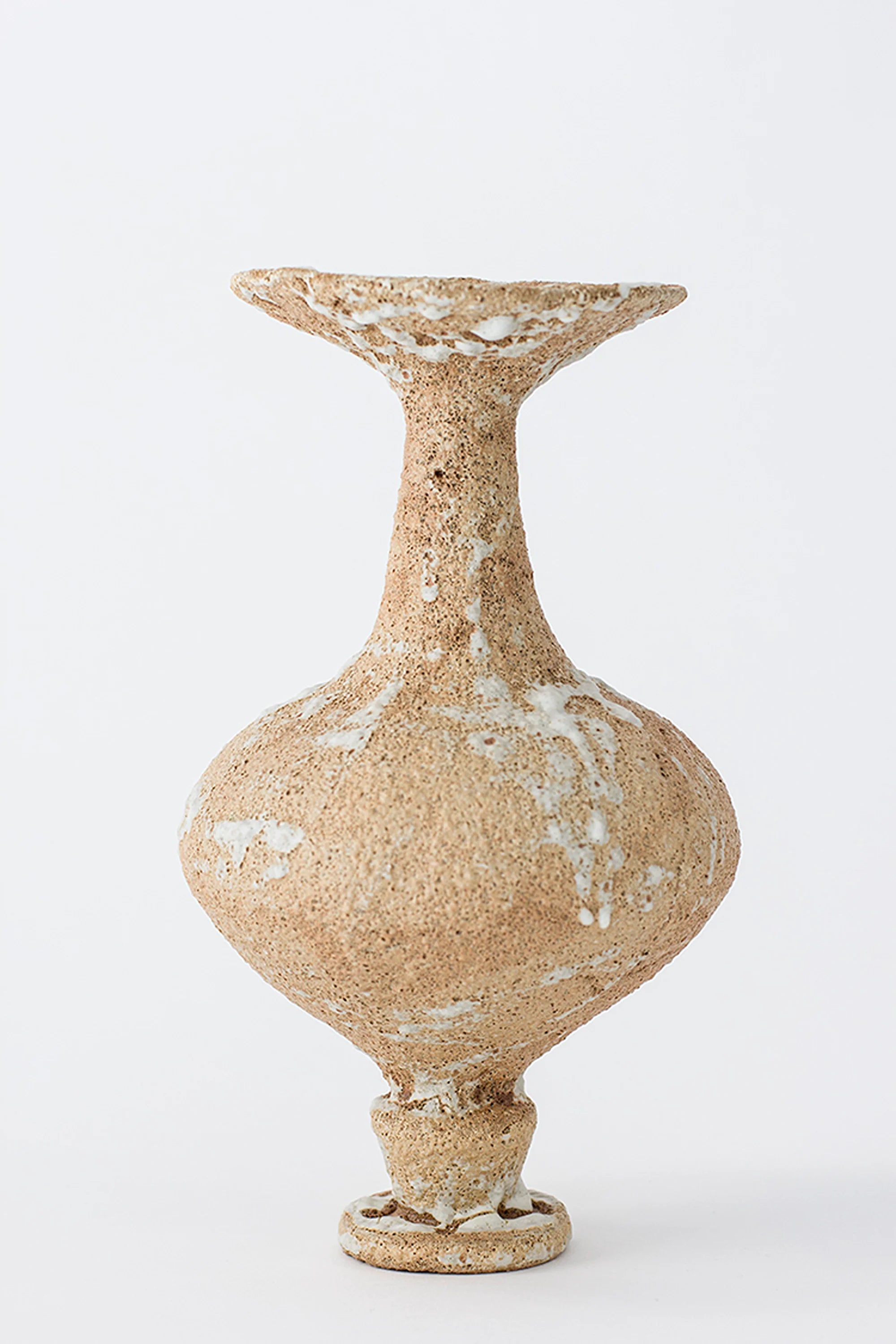 Decorative vase with textured surface on a white background