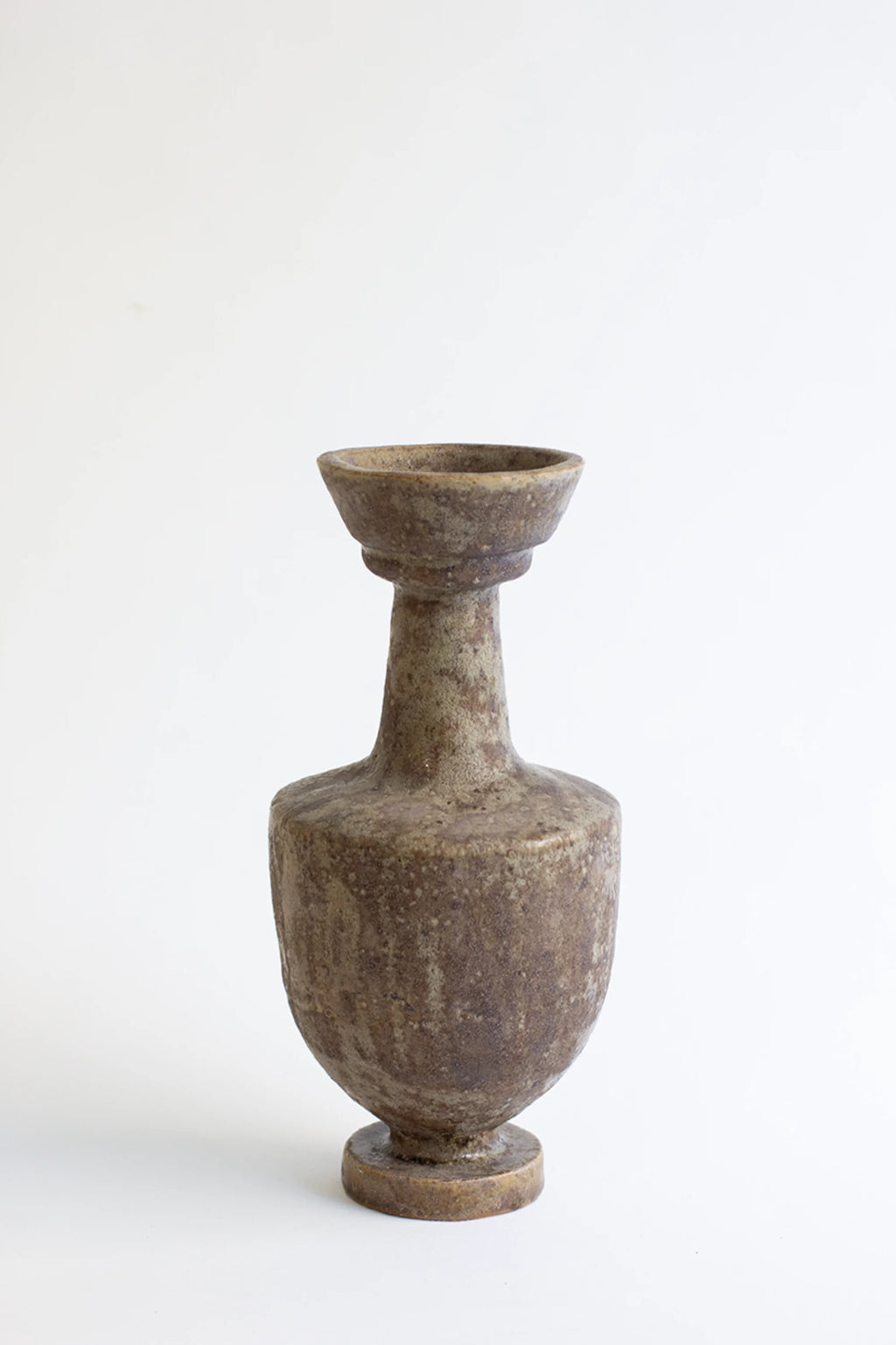 Canoa Lab Arq 003 Búfalo Vase, a classic, elegant ceramic vase with a unique, textured dark brown and beige finish, featuring a slender neck and wider body, displayed on a clean white background.