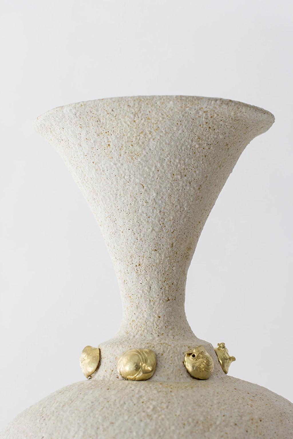 Canoa Lab Isolated n.24 Vase, a premium, handcrafted ceramic vase with a textured, off-white finish and elegant golden accents around its neck, displayed on a clean white background.