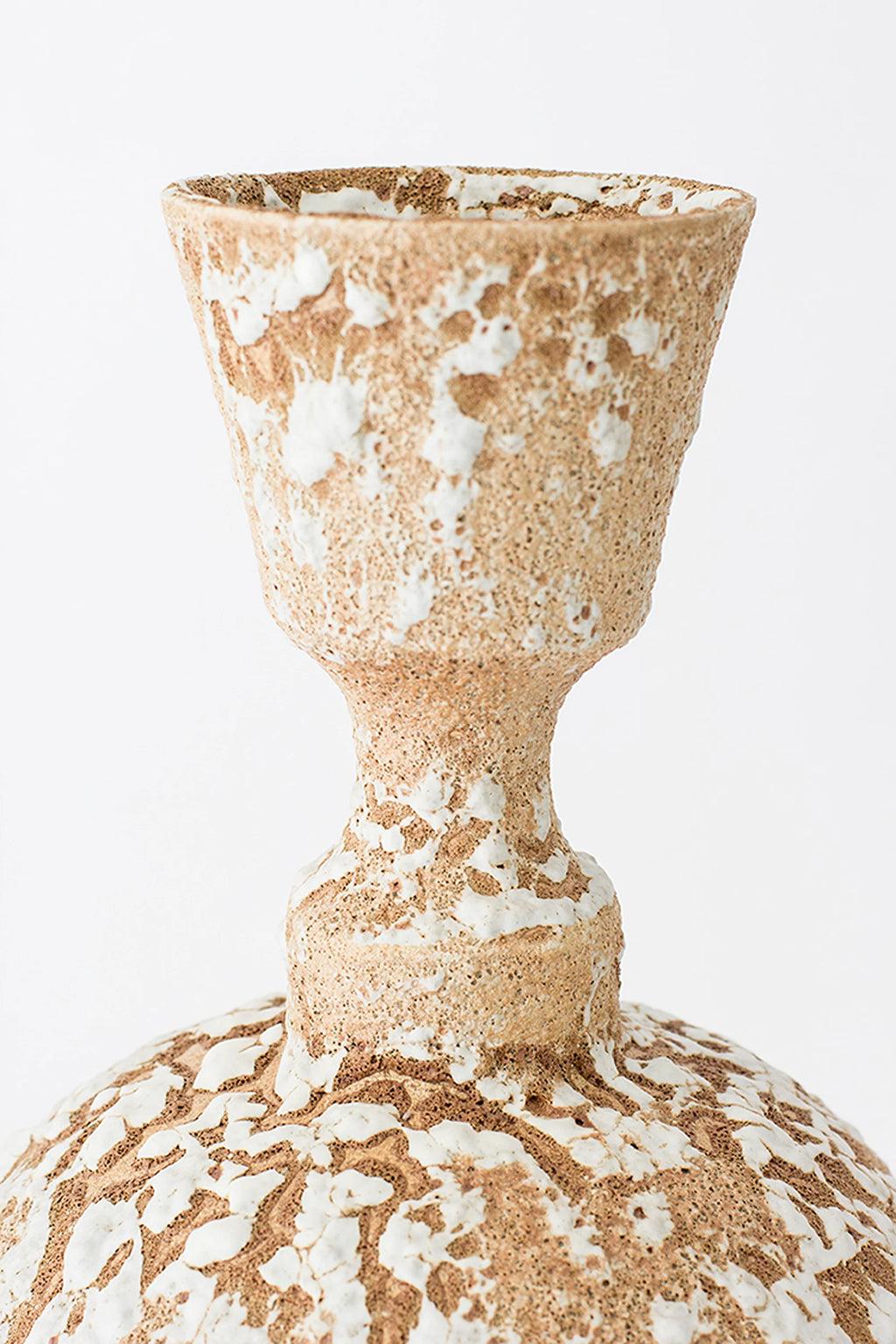 Canoa Lab Isolated n.25 Vase, a close-up of the upper section, showcasing the textured brown ceramic with white glaze patterns and the unique, elongated neck design.