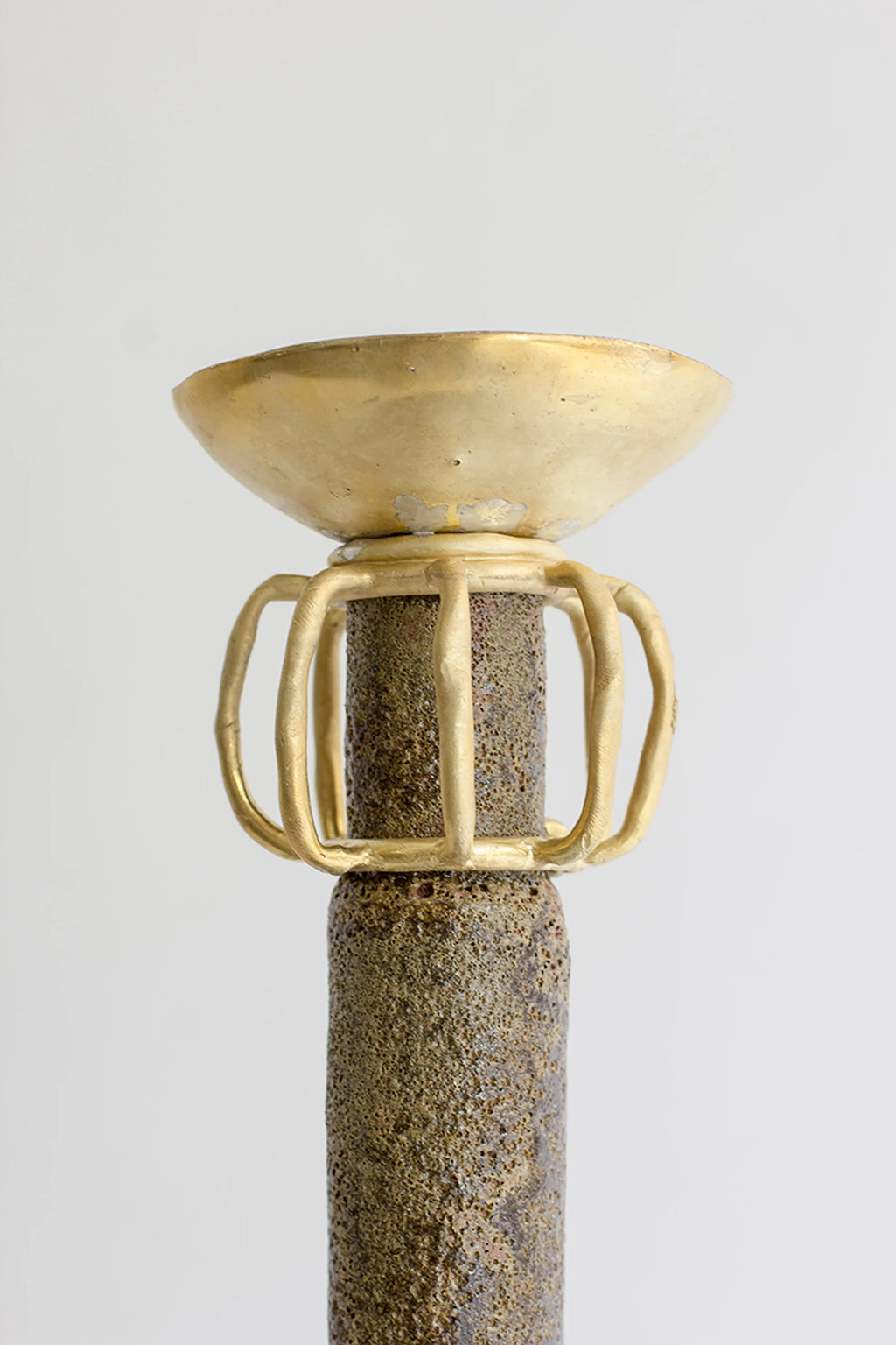 Canoa Lab Isolated n.29 Vase, a tall, slender, textured brown ceramic vase with a striking golden bowl-like top and intricate cage-like golden accents, presented on a minimalist white background.