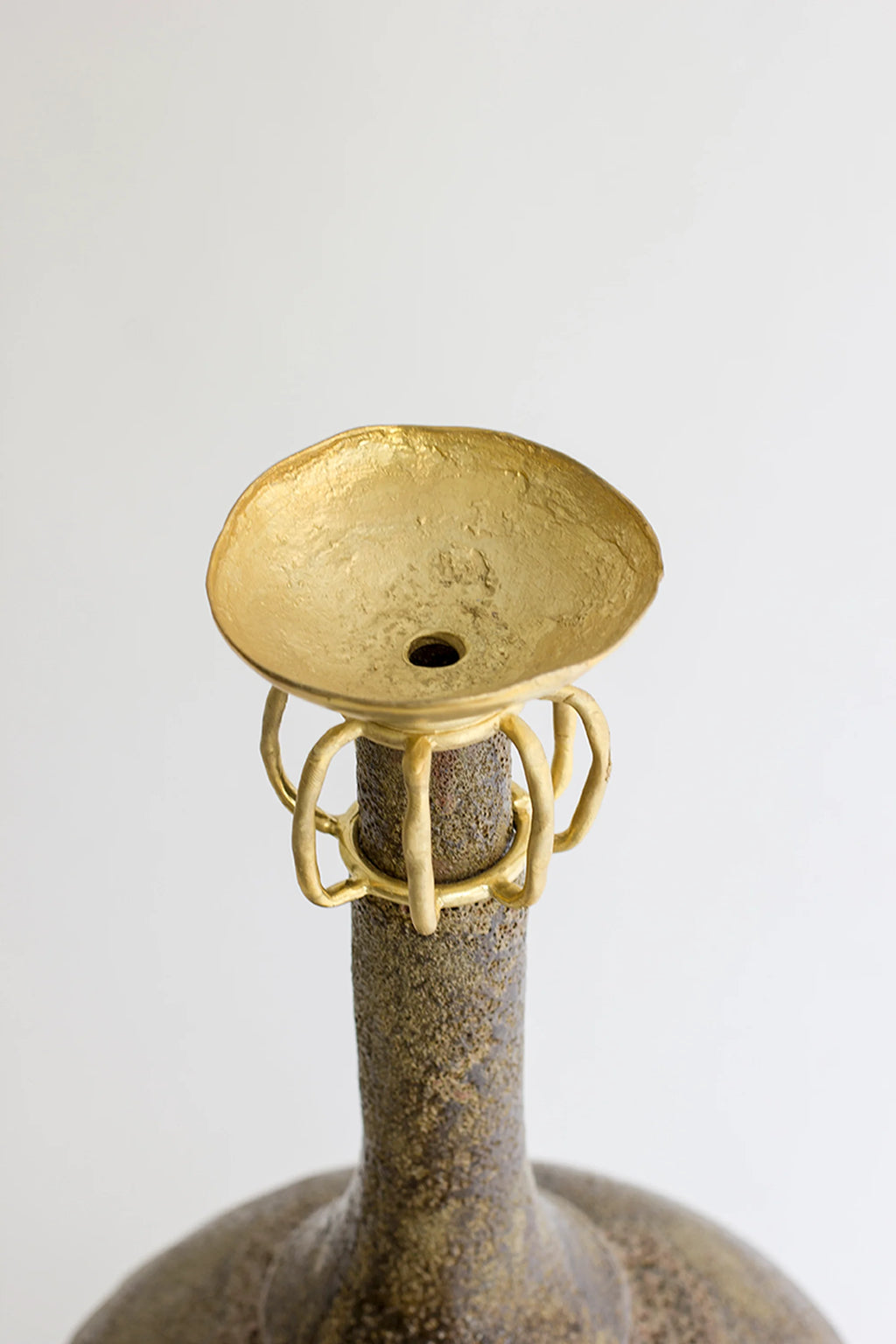 Canoa Lab Isolated n.29 Vase, a top-down view highlighting the vase's golden, textured, bowl-shaped opening with a central hole, surrounded by delicate golden cage-like details, on a white background.