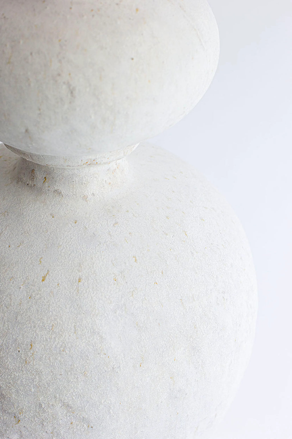 Canoa Lab Isolated n.31 Vase, a detailed close-up of the transition between the two bulbous sections of the elegant white ceramic vase, emphasizing its smooth, matte finish.