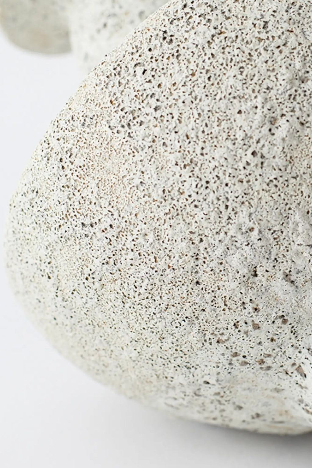 Canoa Lab Lydion Vase, a light grey handcrafted porous ceramic vase with a distinctive volcanic texture and speckled finish, crafted from natural stoneware to create an organic, earthy aesthetic.