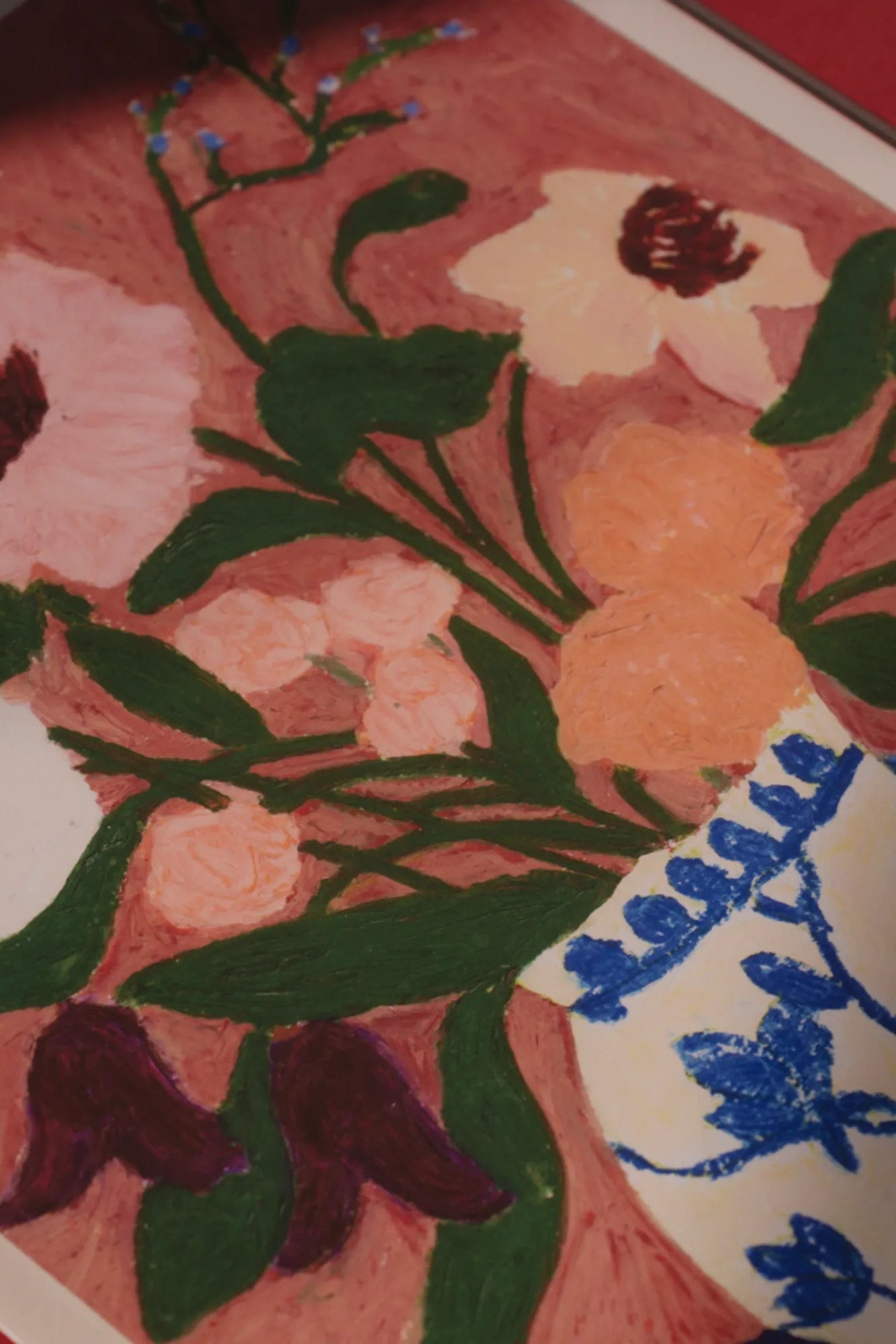 Exquisite floral arrangement featuring a variety of blooms set against a deep blue surface