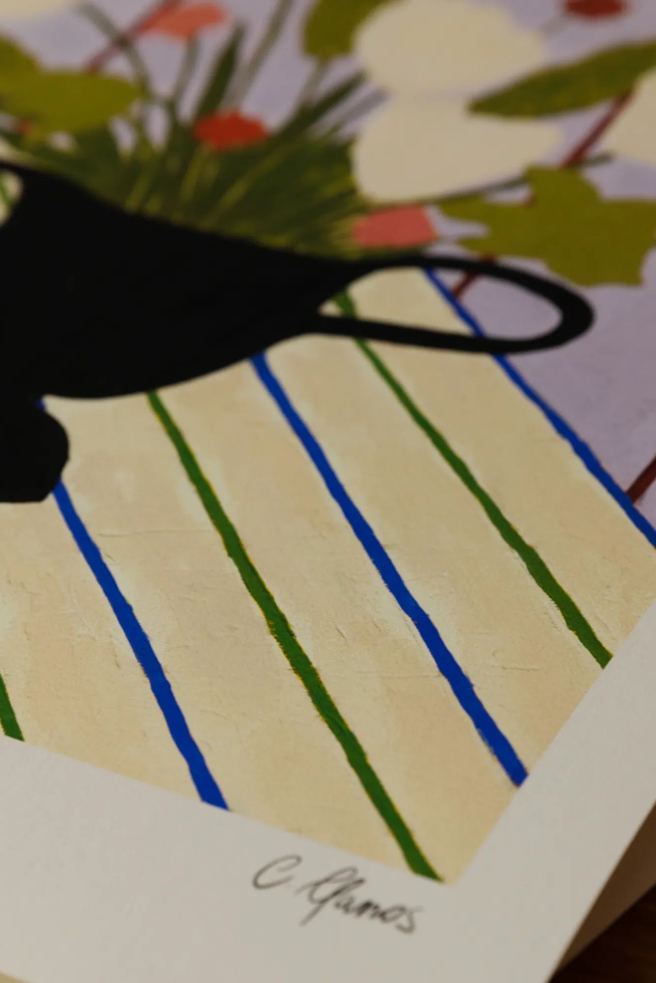 Close up of colorful flowers placed on a striped tablecloth