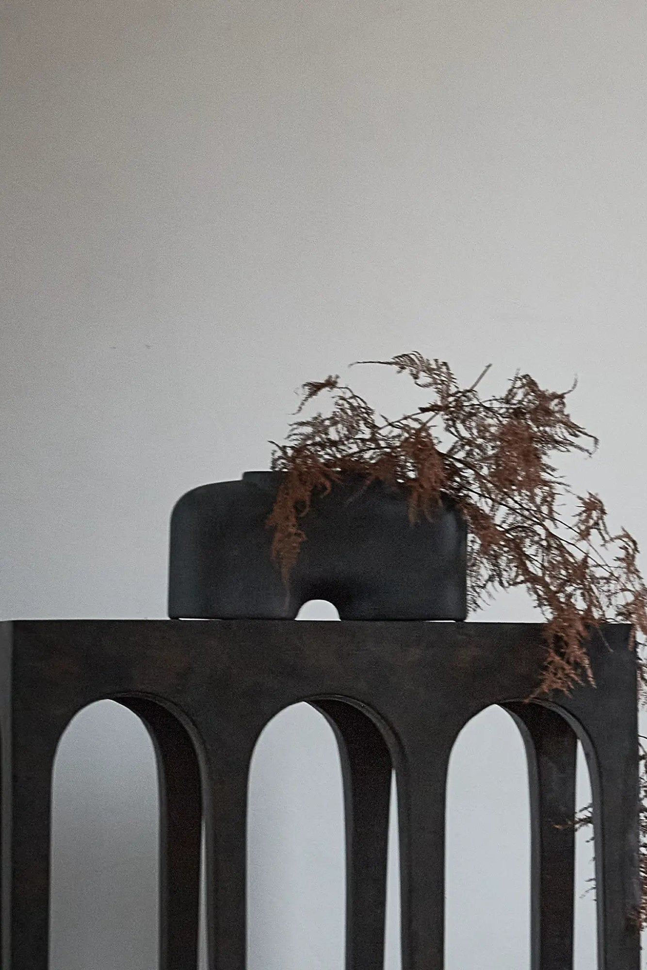 Elegant vase with a wide base and a narrow neck for floral arrangements