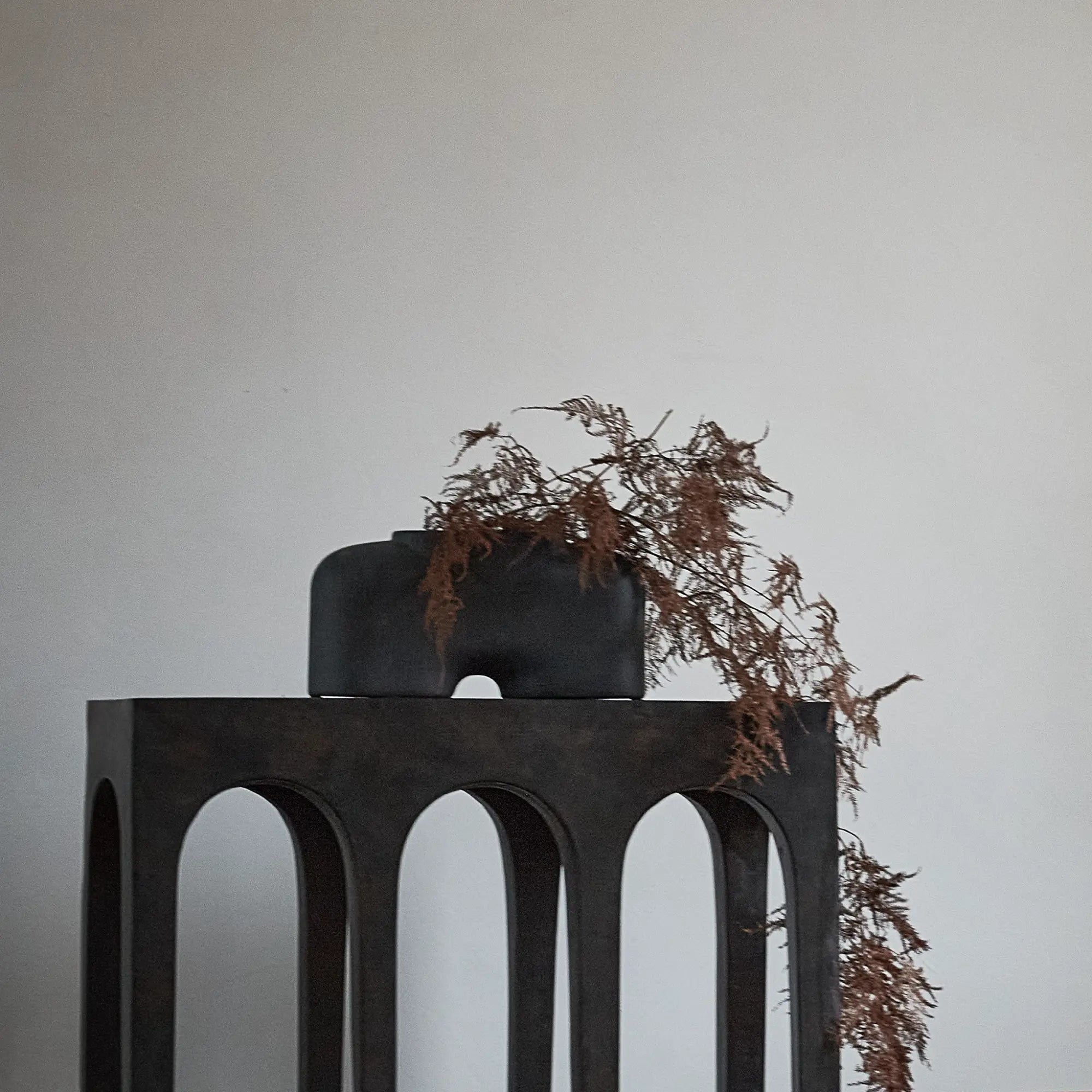 Elegant vase with a wide base and a narrow neck for floral arrangements