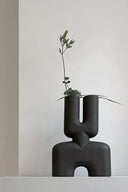 Handcrafted ceramic vase with intricate double cobra design