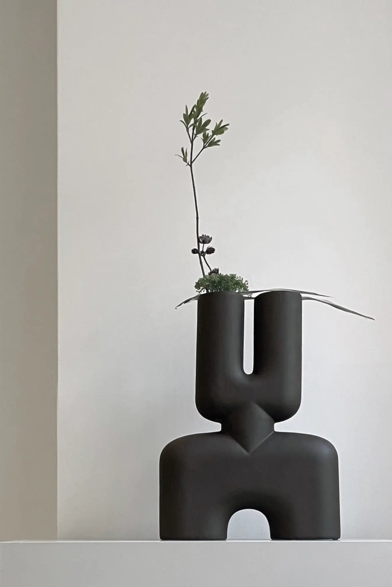 Handcrafted ceramic vase with intricate double cobra design