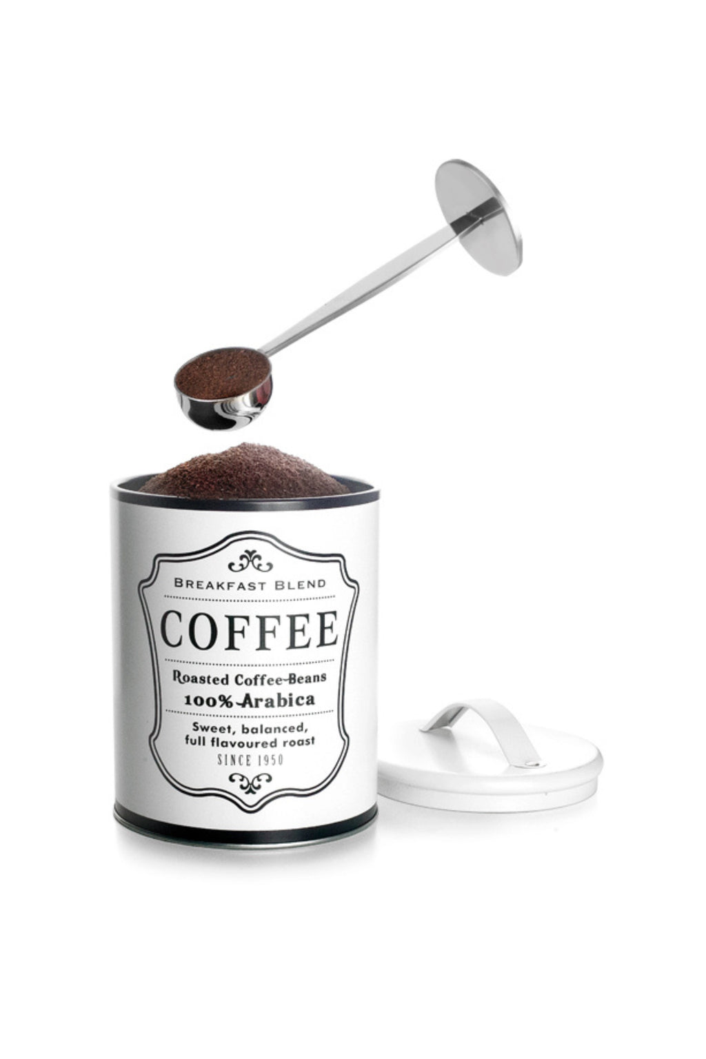 Ibili Coffee Measurer / Press, a sleek stainless steel 2-in-1 coffee scoop featuring a deep measuring spoon and a flat tamper disc. It's pictured above a white cylindrical coffee tin, filled with dark roasted 100% Arabica coffee grounds, ready for brewing. This versatile coffee preparation tool is perfect for precise portioning and tamping, ideal for any home barista or coffee enthusiast.