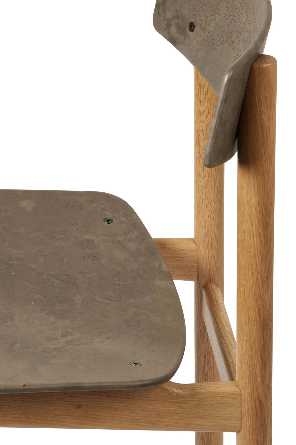 Mater Conscious Chair, a close-up of the light oak wood frame and the unique gray-brown composite seat and backrest, showcasing the sustainable material and modern design, on a white background.