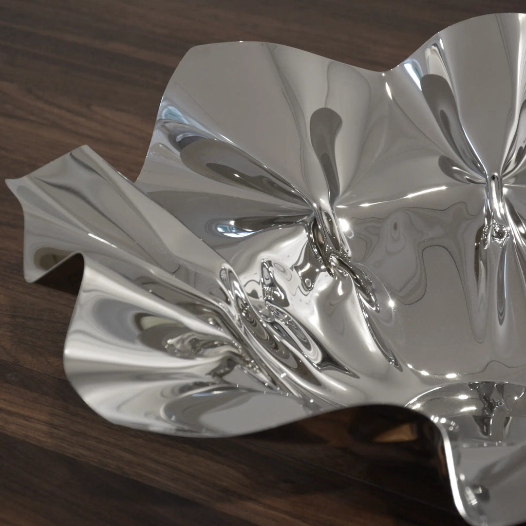 White ceramic contour bowl with smooth curves and elegant design