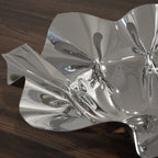 White ceramic contour bowl with smooth curves and elegant design