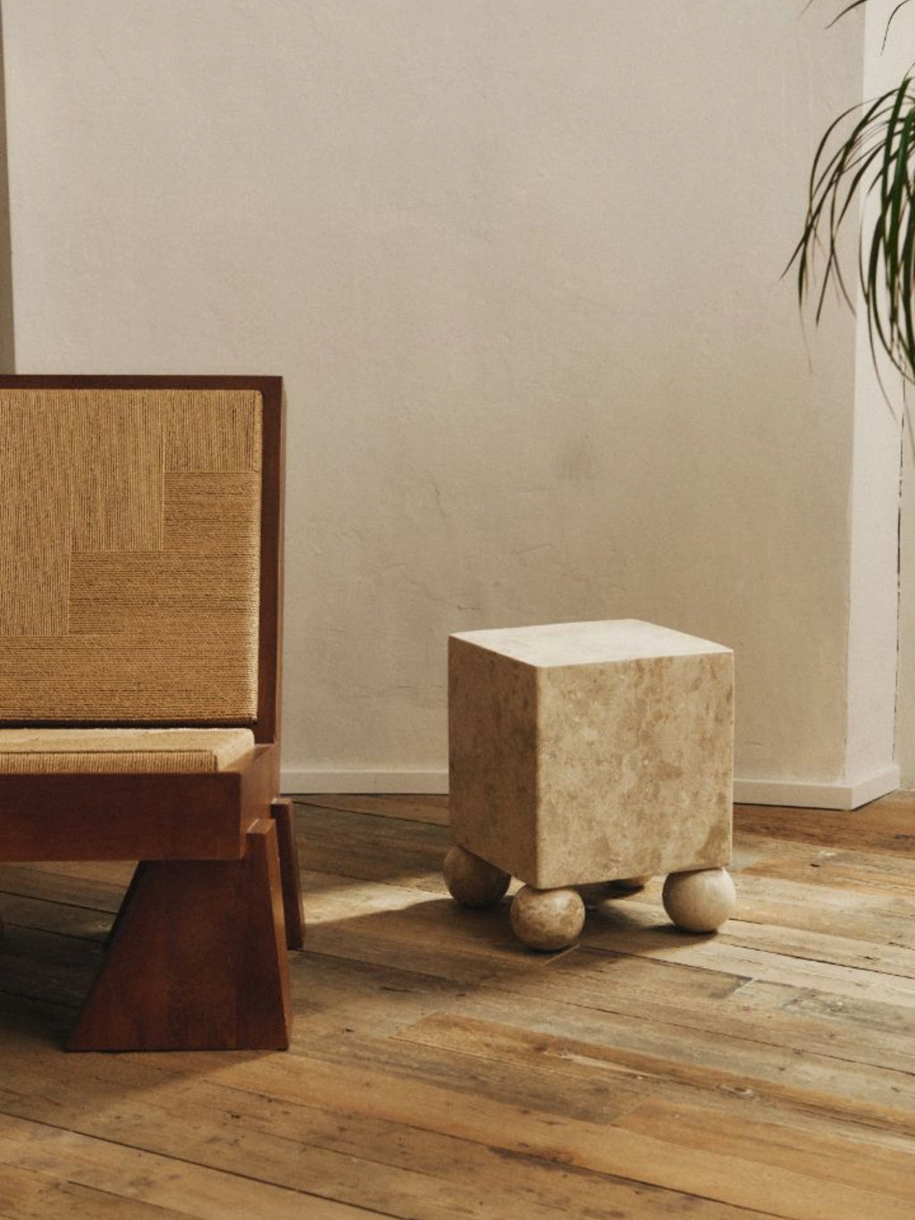 Heaps & Woods Aurelia Side Table, an organic modern accent table featuring a solid cubic travertine top with natural cream and beige tones and a porous texture, elevated by four matching spherical stone legs. This brutalist-inspired yet minimalist design is perfect as a stylish living room side table, contemporary bedroom accent, or unique entryway console.