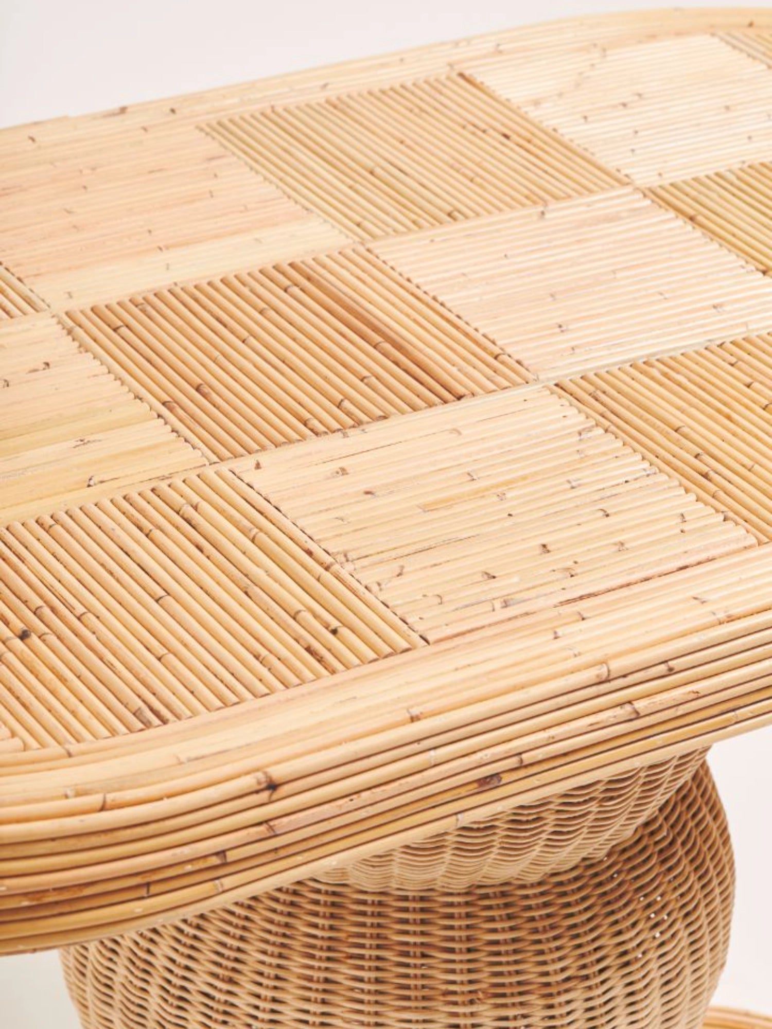 Heaps & Woods Barney Console, a rectangular natural rattan console table with a striking light brown top crafted from individual rattan poles arranged in a unique checkerboard pattern and rounded edges.