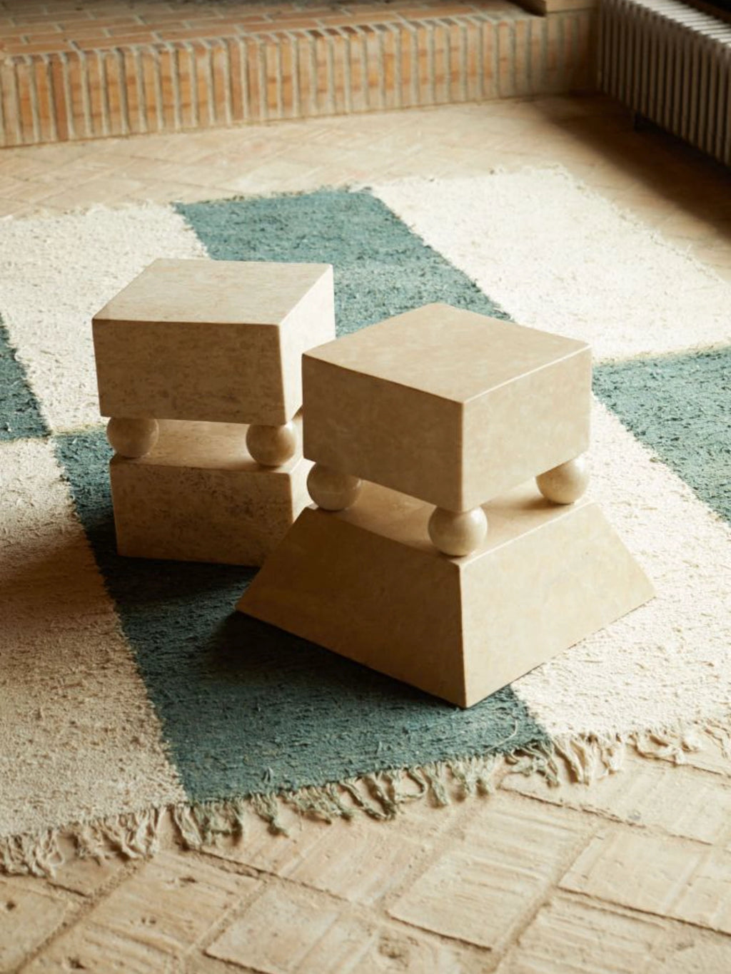 Heaps & Woods Conor Side Table, a sculptural organic modern accent table crafted from natural light beige travertine stone with a subtly textured finish.