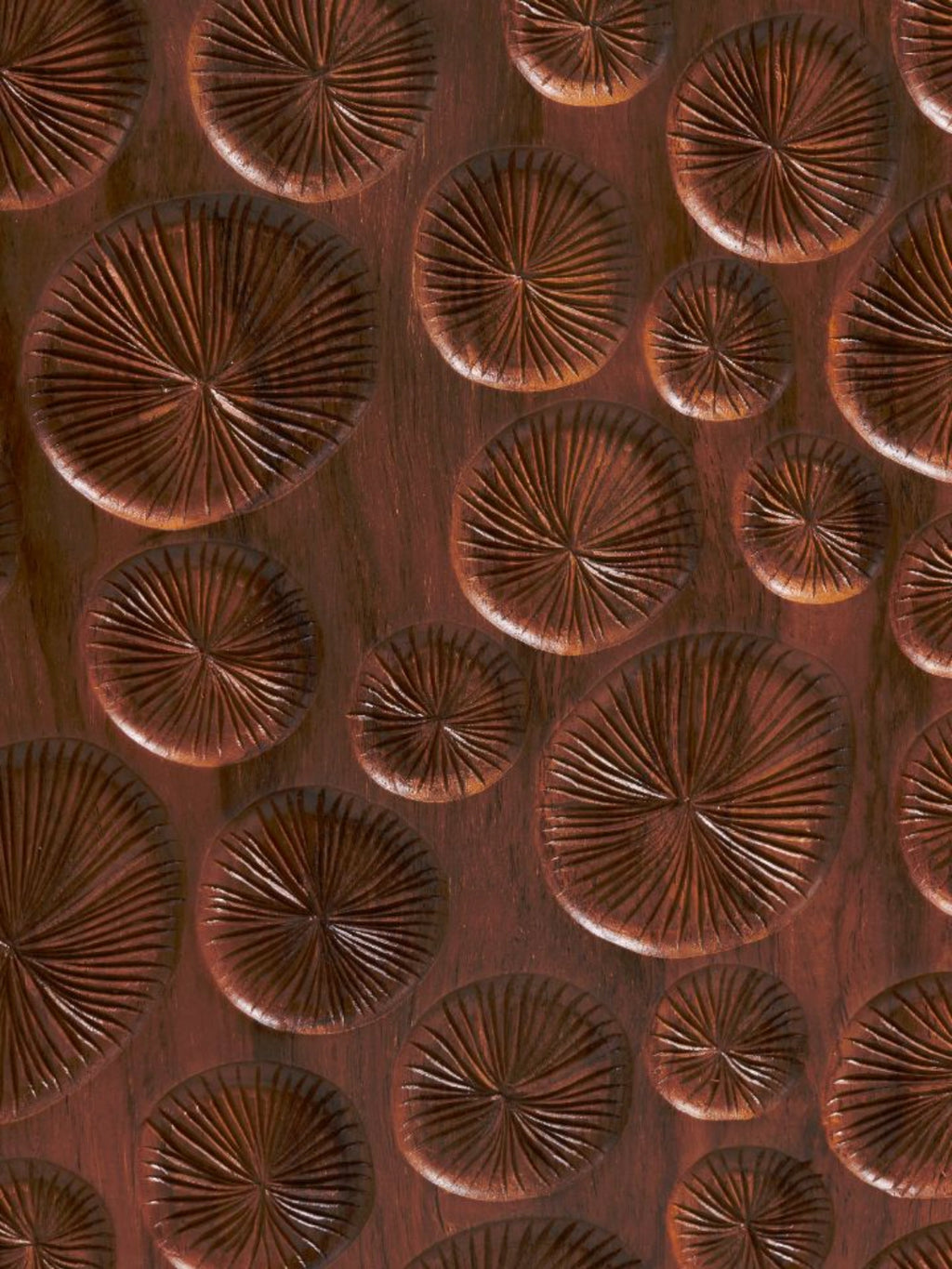 Heaps & Woods Cordelia 80 Console, a luxurious dark brown solid wood console table featuring a richly textured, hand-carved surface with organic circular relief patterns of varying sizes and radial.