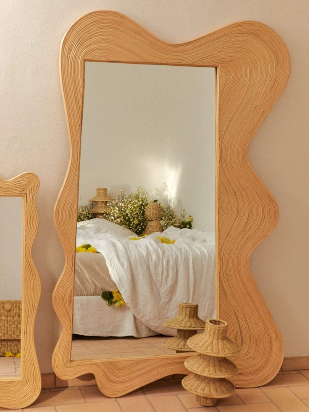 Heaps & Woods Zoe Mirror, a full-length organic modern mirror featuring a unique wavy, irregular frame crafted from natural coiled rattan in a warm, light wood tone, showcasing intricate texture and a fluid silhouette. This statement rattan floor mirror adds a bohemian and coastal style accent, perfect for bedrooms, living rooms, or entryways.