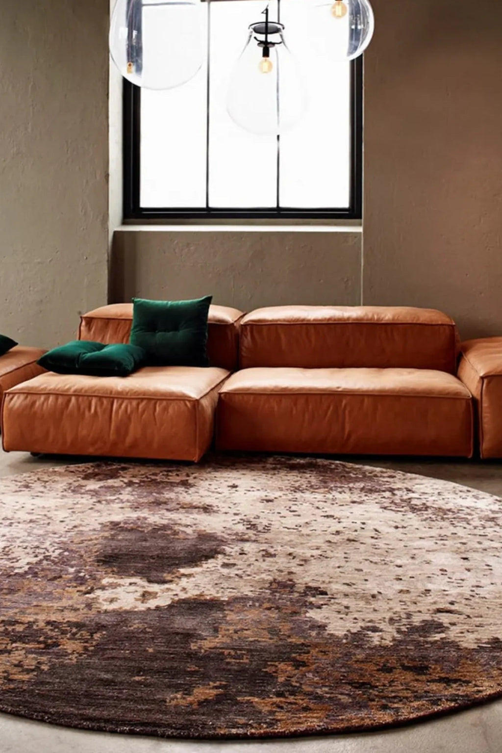 Handwoven grey and white circular Moon Rug made of soft, durable materials