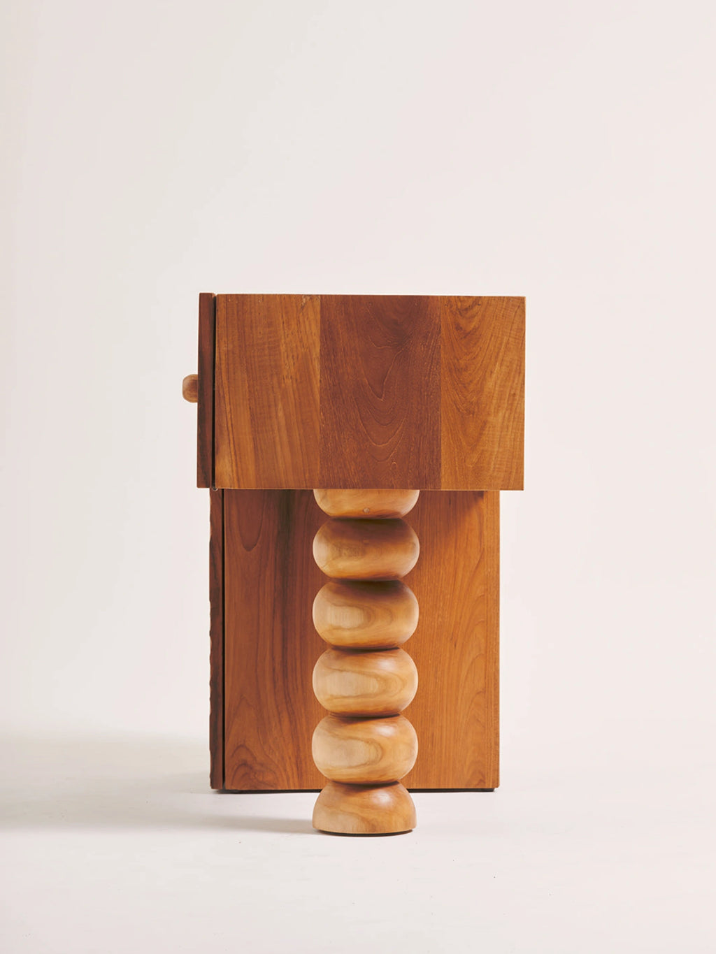 Heaps & Woods Cordelia 80 Console, a warm brown solid wood console table featuring a clean rectangular top and single drawer with a round pull, supported by a distinctive natural turned wood stacked.