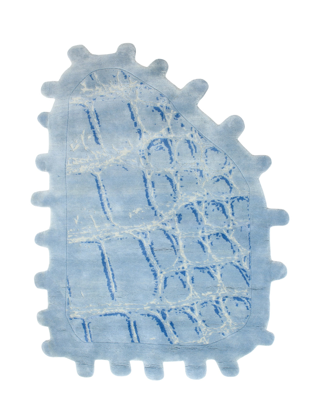 Haus Üger Crocodile Rug, a playful light blue soft pile rug featuring a unique irregular organic shape with rounded, gear-like edges.