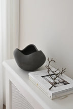 Large white ceramic curve bowl with smooth, rounded edges and a spacious interior for serving or display