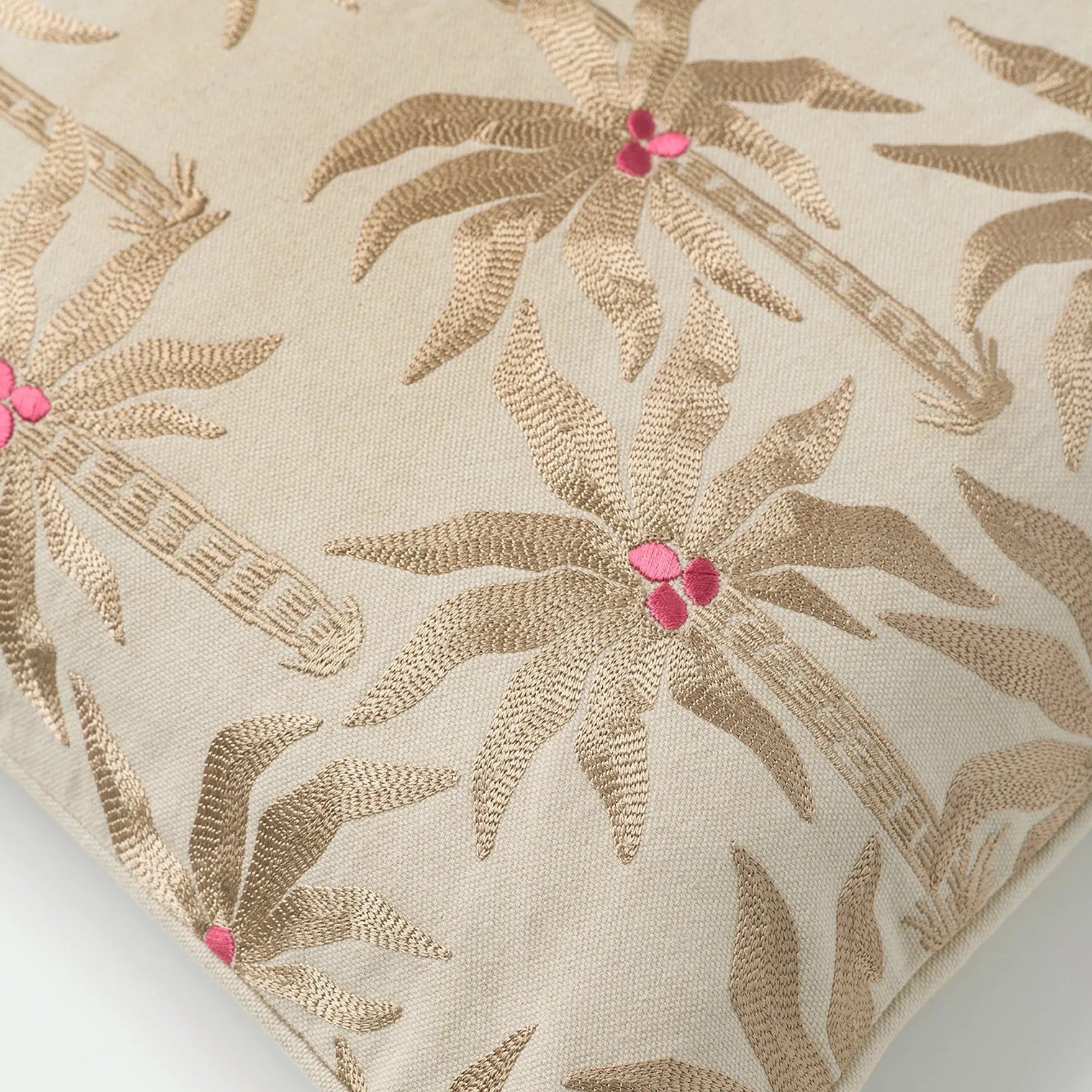  A close-up of a Laura Cushion with a hand-painted floral design