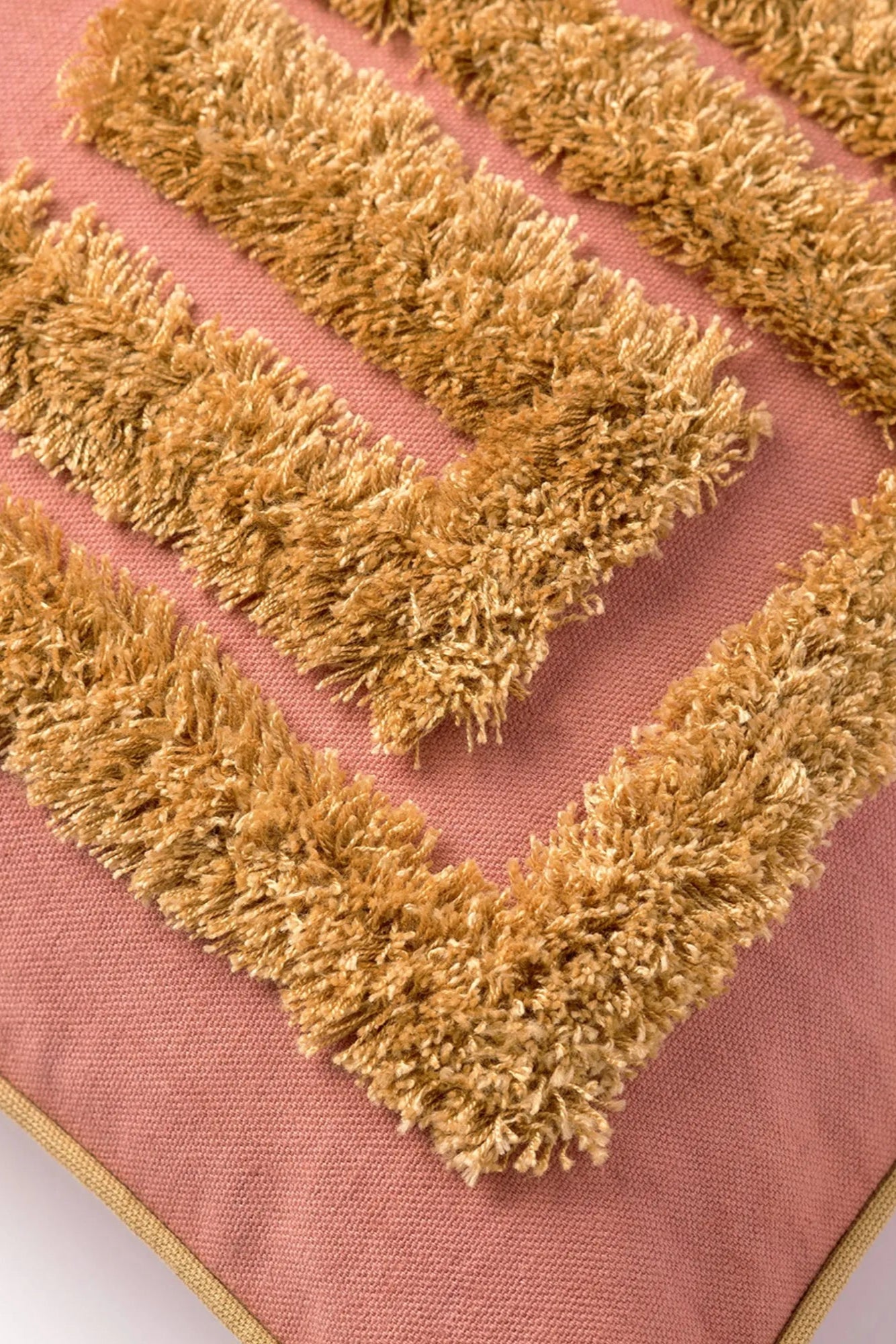Soft and luxurious Cleo Cushion Cover in vibrant red with intricate embroidery details and tassel accents
