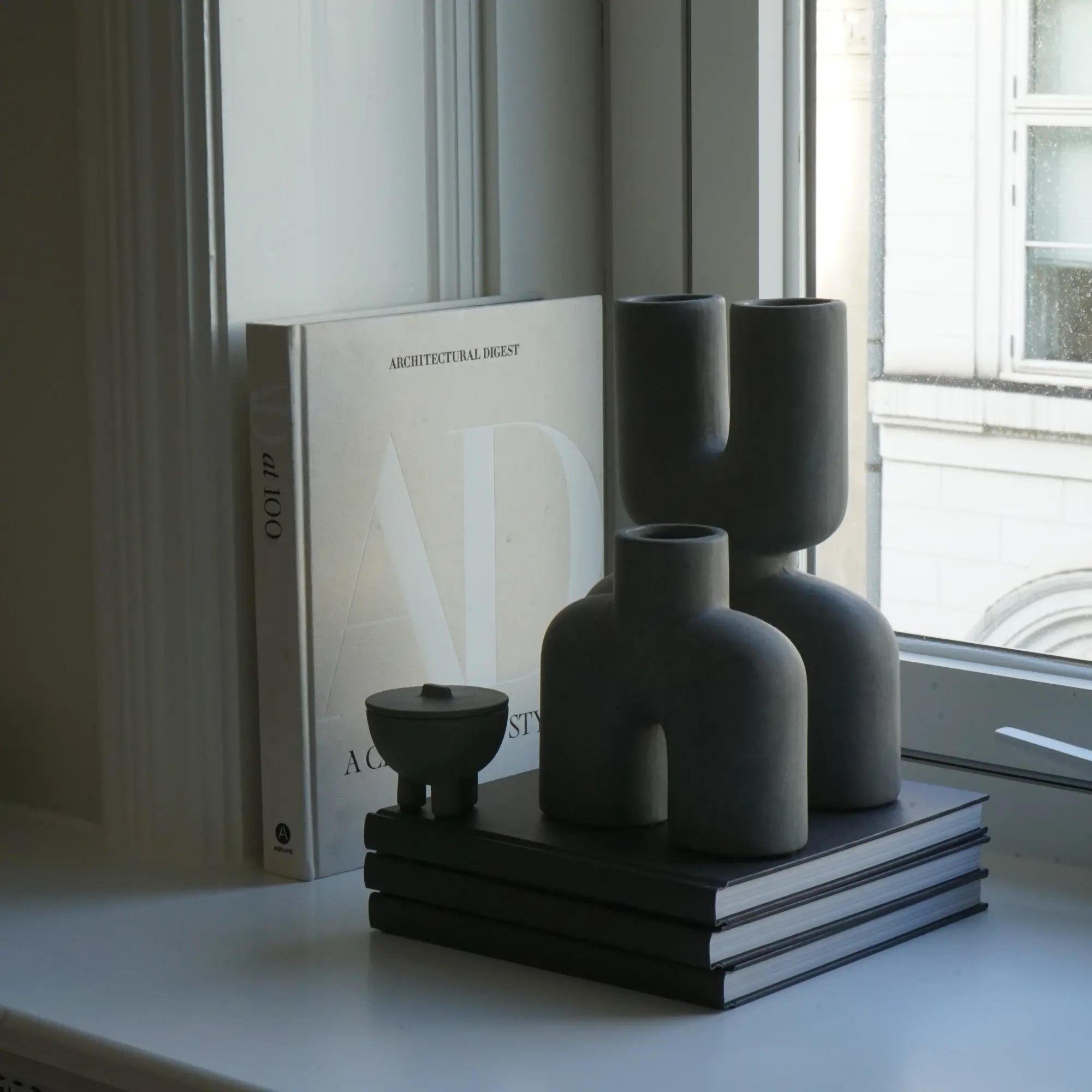 Handcrafted Double Cobra Vase - Mini, featuring two intricately designed cobras coiled around a sleek, contemporary vase, perfect for adding a touch of exotic elegance to any space