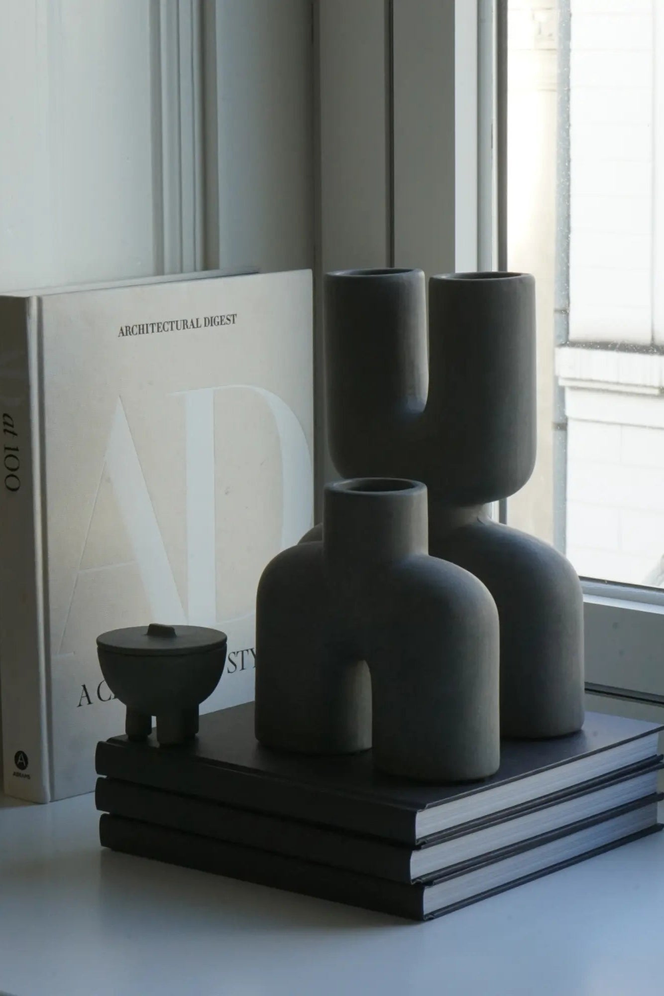 Handcrafted Double Cobra Vase - Mini, featuring two intricately designed cobras coiled around a sleek, contemporary vase, perfect for adding a touch of exotic elegance to any space