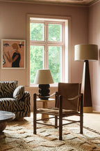 Rustic brown leather Safari Chair with wooden frame and armrests