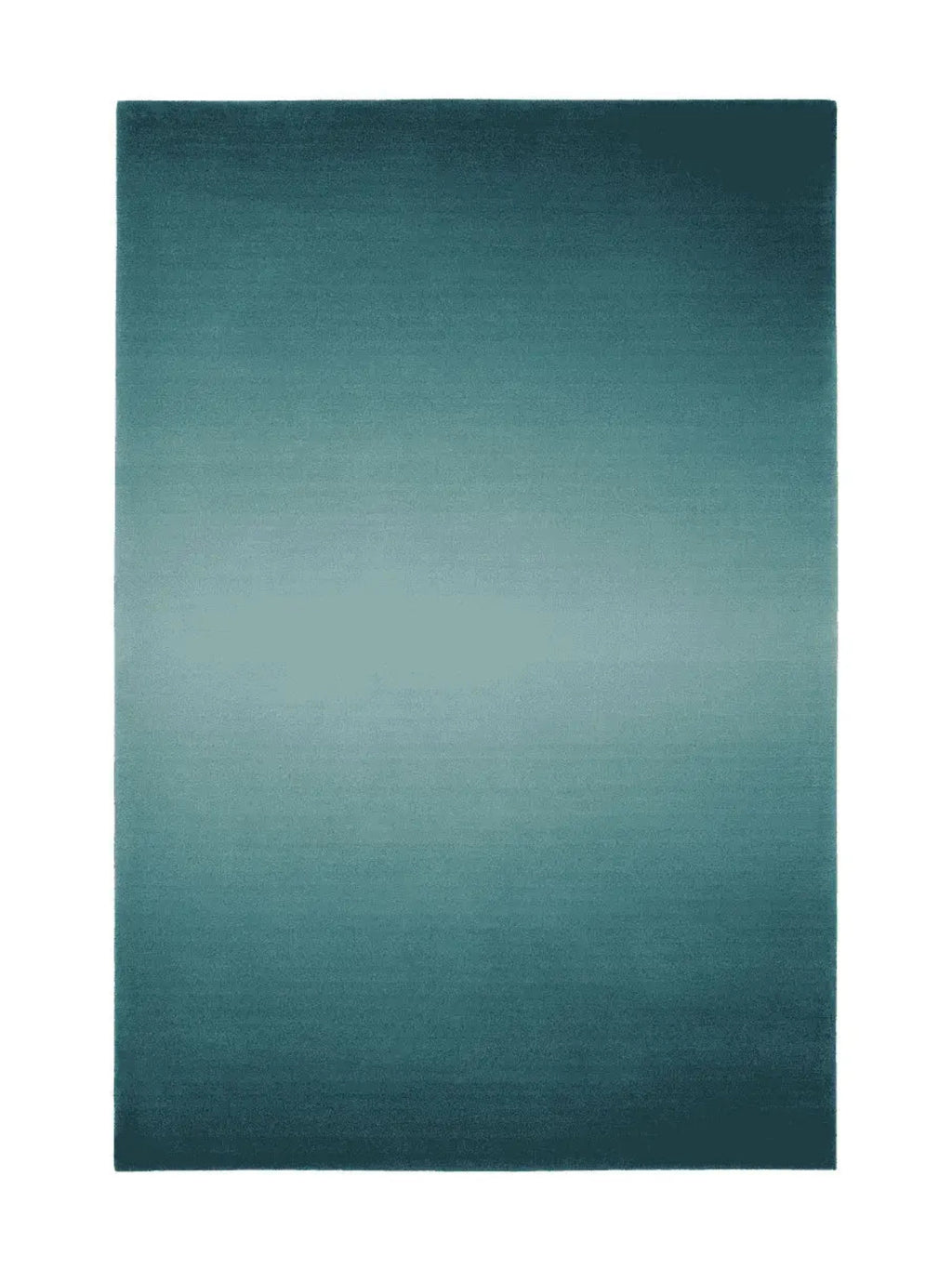 alp_ Degradé Double Rug, a rectangular modern area rug featuring a striking teal gradient design that transitions from deep petrol blue at the ends to a lighter aqua in the center, creating an ombre effect. Its soft, plush pile offers a luxurious texture, perfect for adding a contemporary touch to living rooms, bedrooms, or modern minimalist interiors.