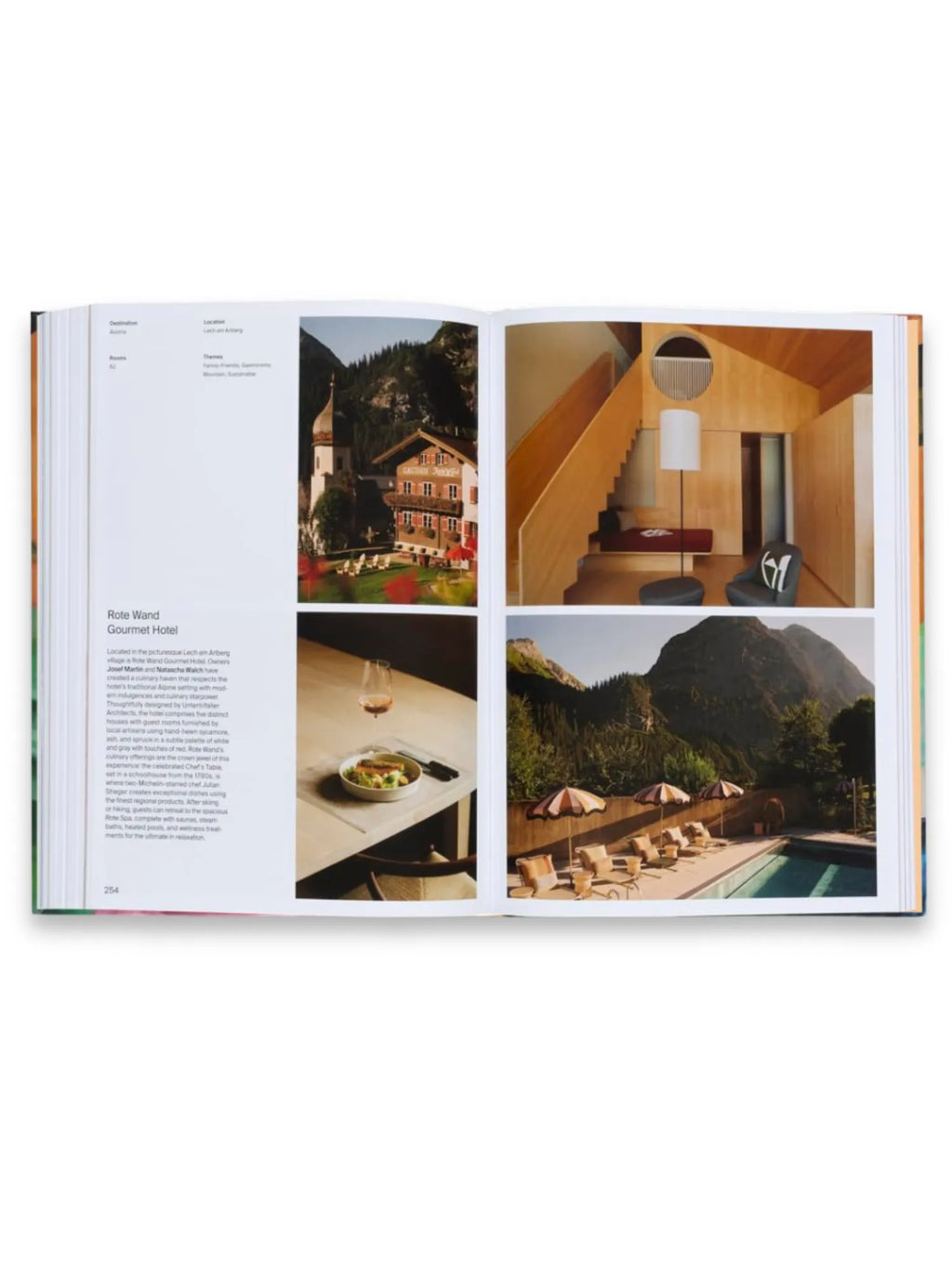 Book Designed to Stay, an open luxury hardcover travel book displaying vibrant pages with detailed hotel and resort images, including a cozy wooden interior with a reading nook, and an outdoor pool area with striped umbrellas. This premium coffee table book is perfect for travel enthusiasts and design aficionados seeking inspiration for their next stylish getaway.